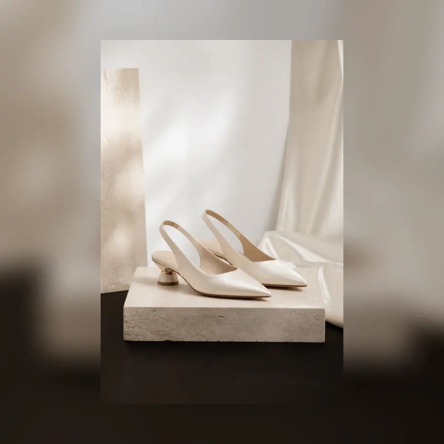 Colette Satin Slingback Pumps — material detail showing texture, scale, and tonal character